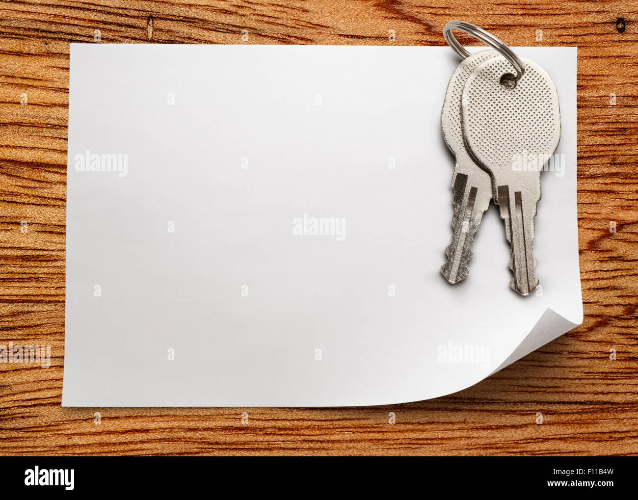Blank sheet of paper with iron keys Stock Photo - Alamy