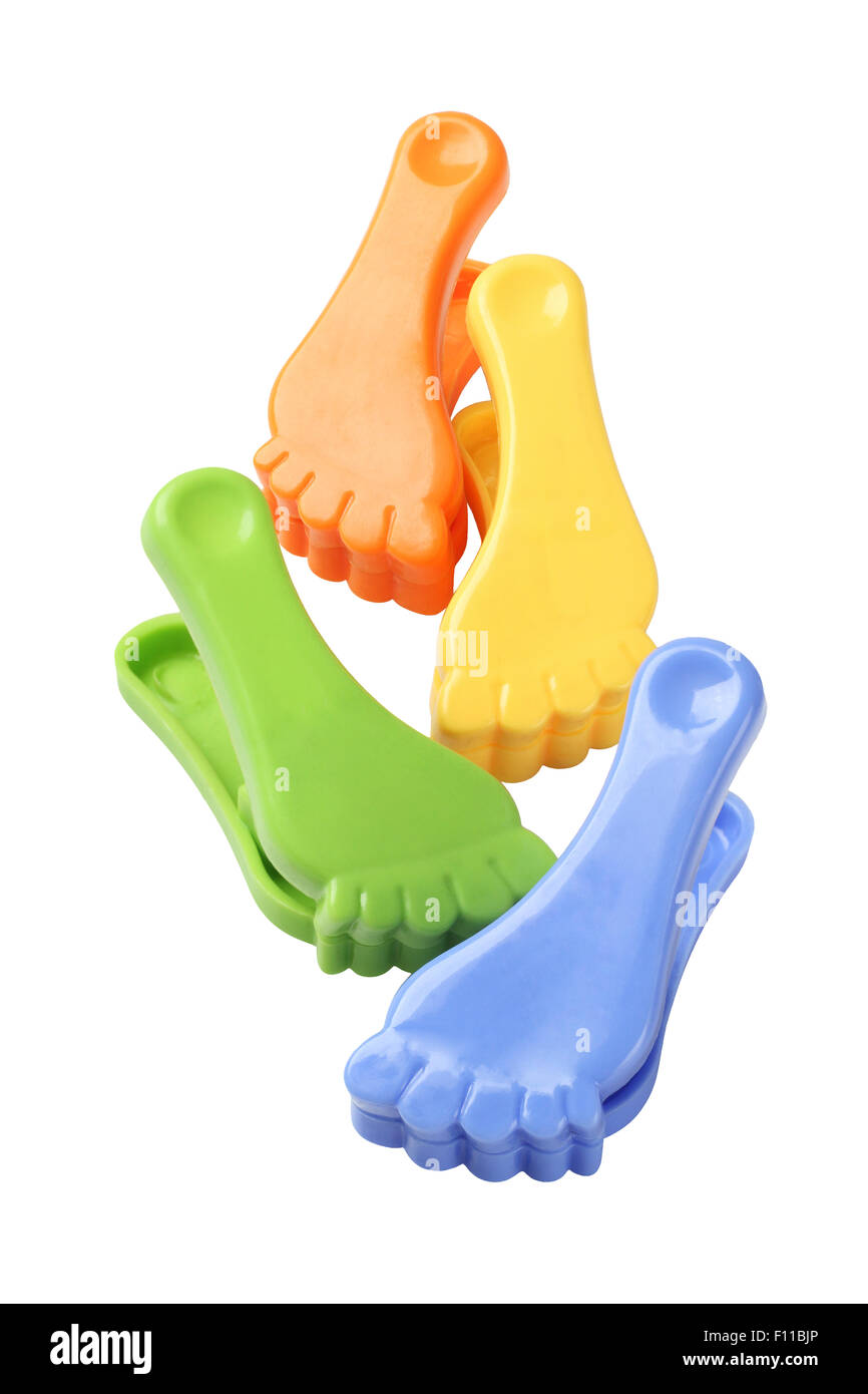Colourful Foot Shape Plastic Clothes Pegs on White Background Stock Photo