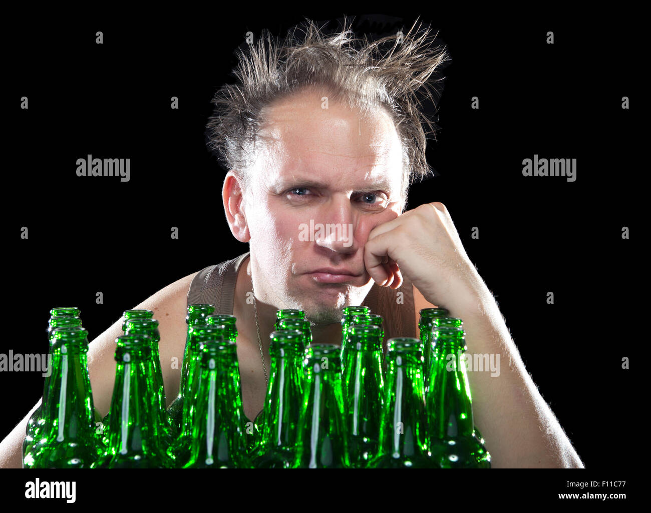 The happy tipsy man near empty beer bottles Stock Photo Alamy