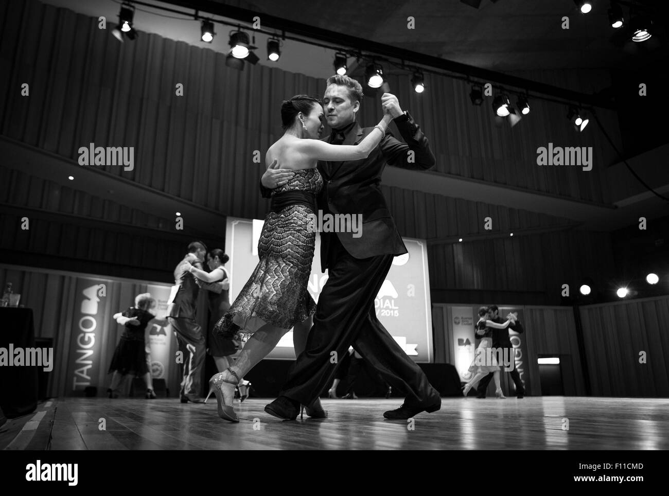 (150825) -- BUENOS AIRES, Aug. 25, 2015 (Xinhua) -- Chinese dancer Ping Yu and her Ukrainian partner Sergiy Podbolotnyy dance during semifinals of the Tango World Cup in Buenos Aires city, capital of Argentina, on Aug. 24, 2015. Tango is sweeping across Argentina's borders, taking Asia, especially China, by storm. This year's key competitive event, the 2015 Tango Festival and World Cup, which is being held Aug. 14 to 27 in Argentina's capital Buenos Aires, features couples from around the globe, including a Ukrainian/Chinese couple. Ukrainian-born dancer Sergiy Podbolotnyy and his Chinese part Stock Photo