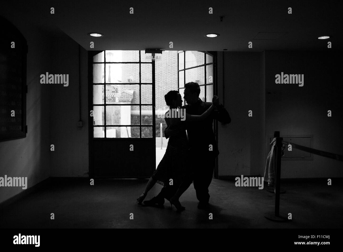 (150825) -- BUENOS AIRES, Aug. 25, 2015 (Xinhua) -- Chinese dancer Ping Yu and her Ukrainian partner Sergiy Podbolotnyy rehearse in the backstage before their participation in the semifinals of the Tango World Cup, in Buenos Aires city, capital of Argentina, on Aug. 24, 2015. Tango is sweeping across Argentina's borders, taking Asia, especially China, by storm. This year's key competitive event, the 2015 Tango Festival and World Cup, which is being held Aug. 14 to 27 in Argentina's capital Buenos Aires, features couples from around the globe, including a Ukrainian/Chinese couple. Ukrainian-bor Stock Photo