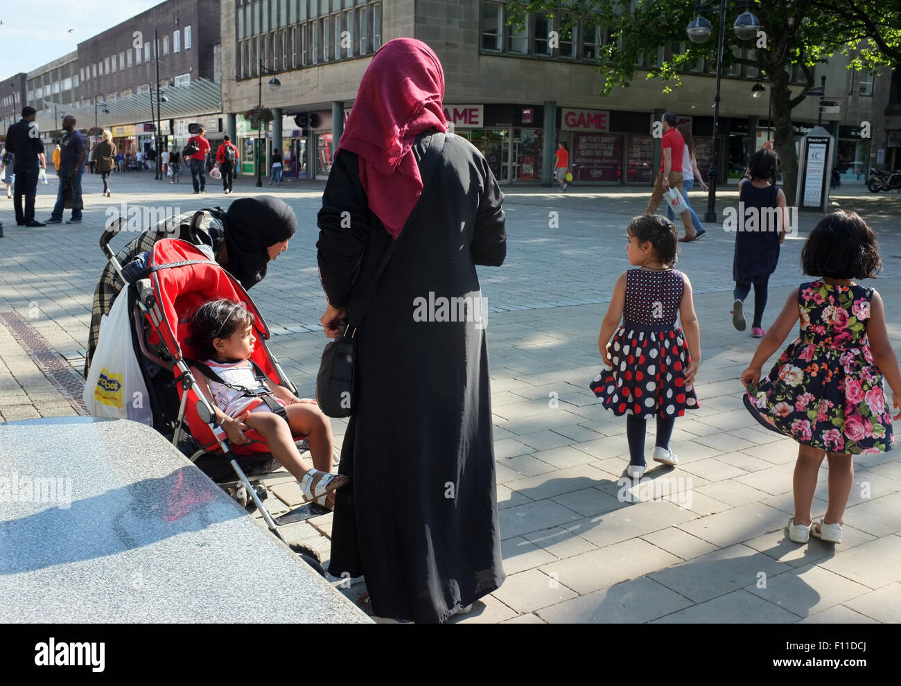 Asian family of females out shopping in Victoria Square Bolton, Lancashire, England UK Stock Photo