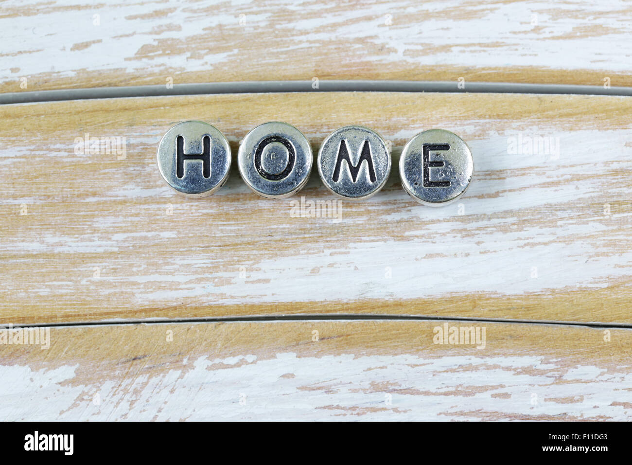 the word 'HOME' written in metal letters Stock Photo