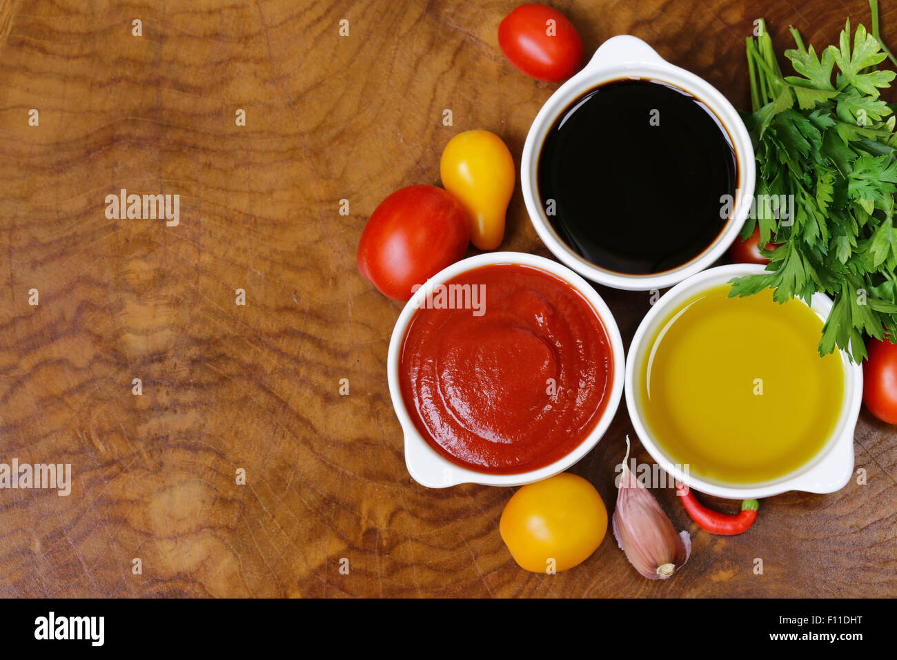 traditional Italian sauces balsamic vinegar, tomato sauce and olive