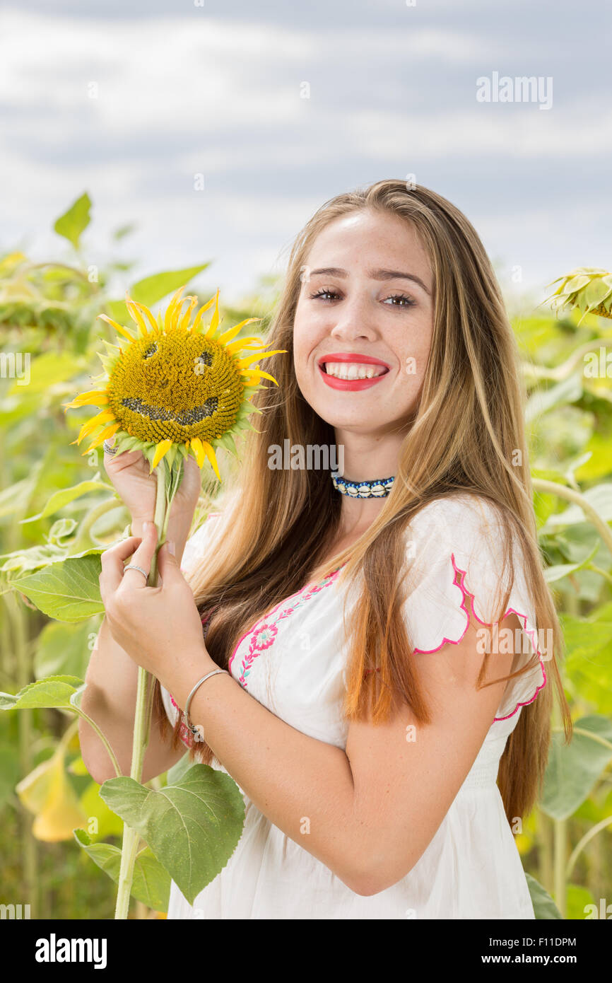 Girl with sunflower Stock Photo - Alamy