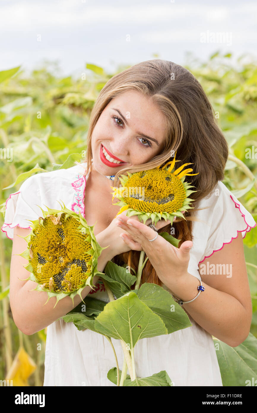 Girl with sunflower Stock Photo - Alamy