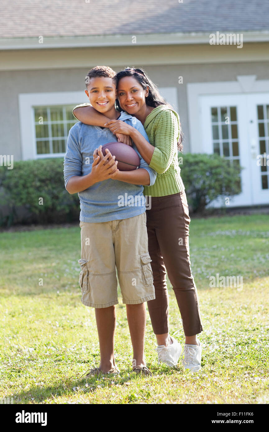 Indian son hugging mother hi-res stock photography and images - Alamy