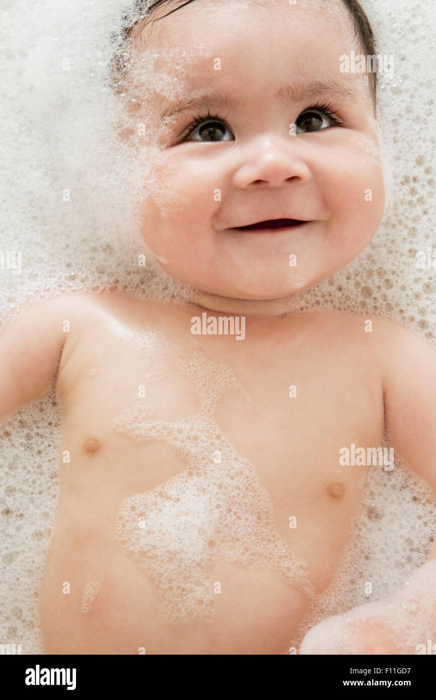 Close up of mixed race baby in bubble bath Stock Photo Alamy