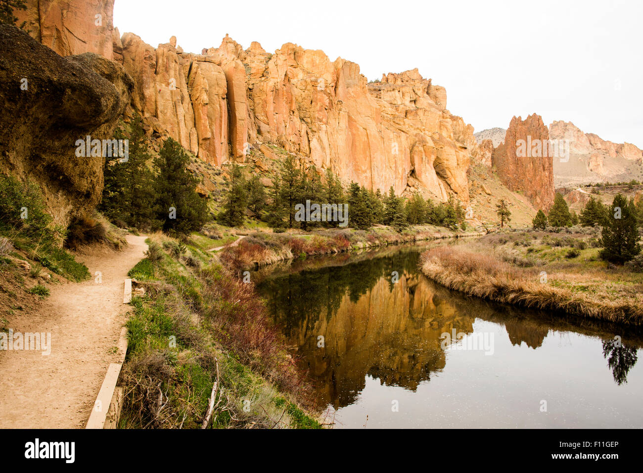 Desert cliffs reflecting in still river, Smith Rock State Park, Oregon, United States Stock Photo