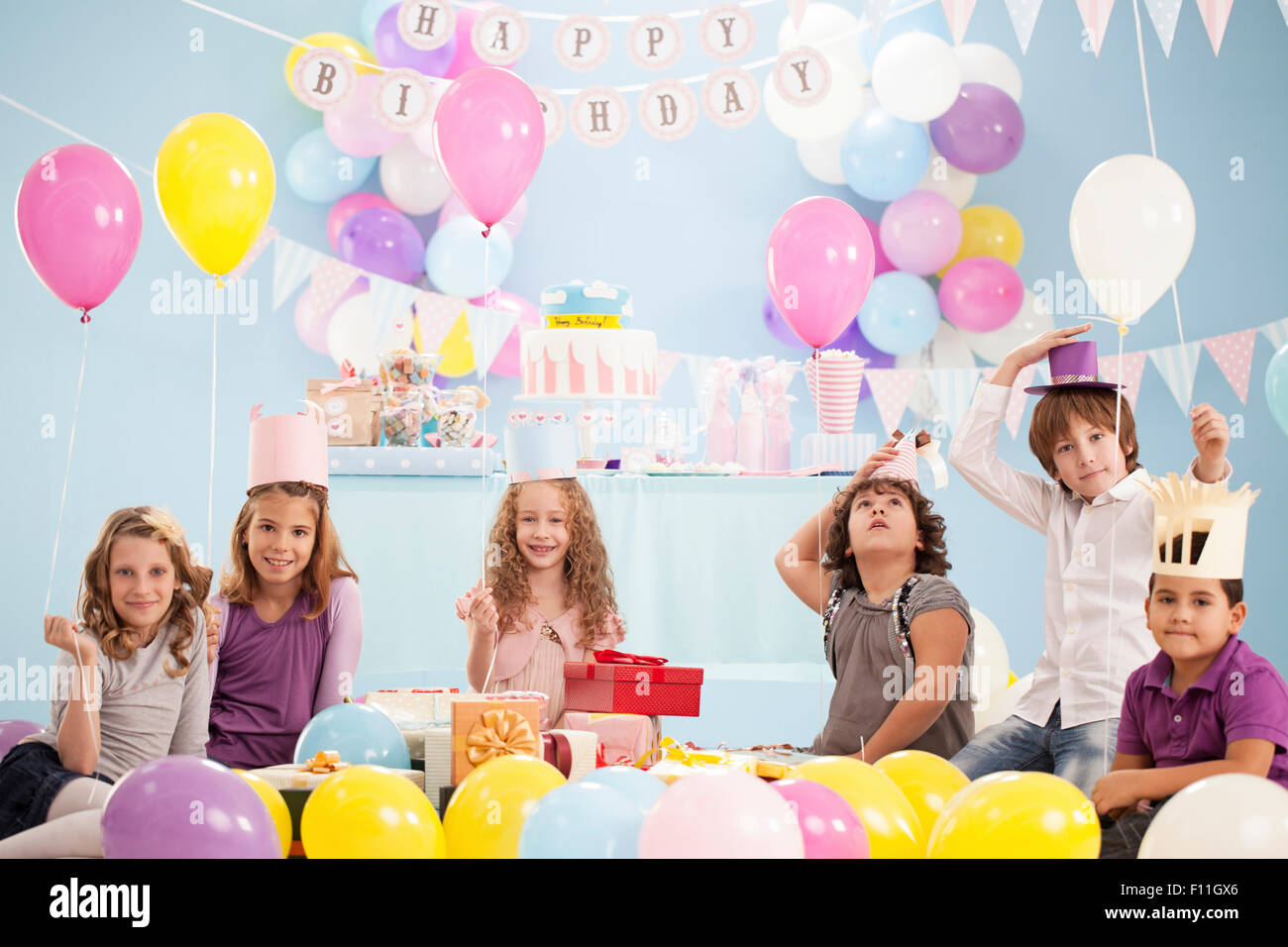 Boy wearing birthday party hat hi-res stock photography and images - Alamy