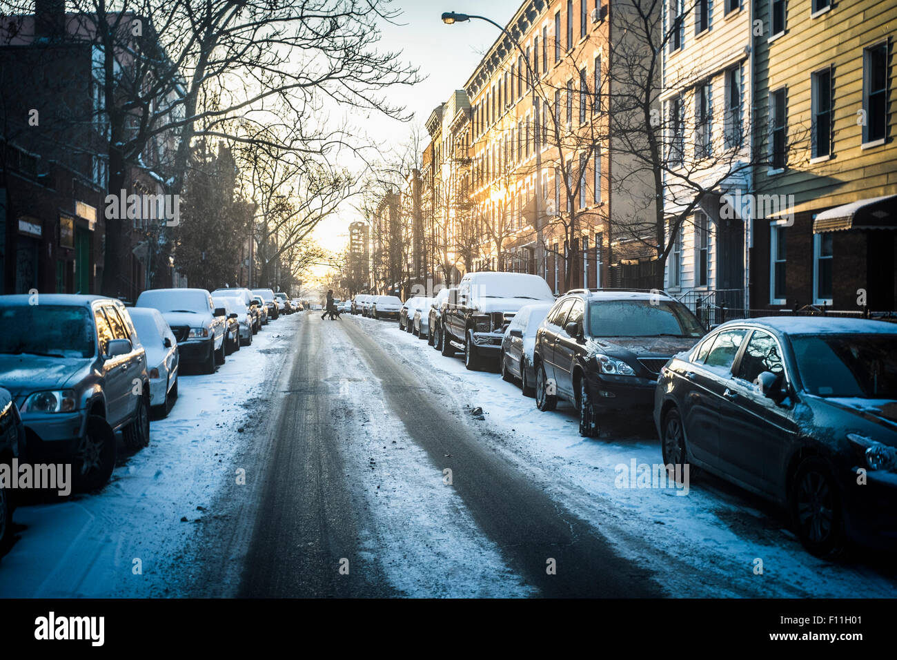 Tire tracks in snow on city street, New York, New York, United States Stock Photo