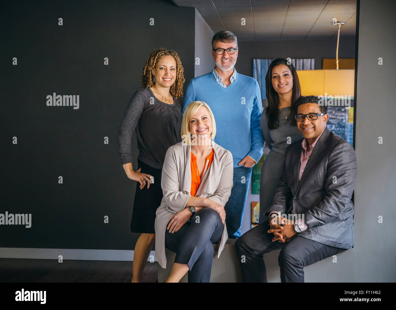 Business people smiling in office Stock Photo - Alamy