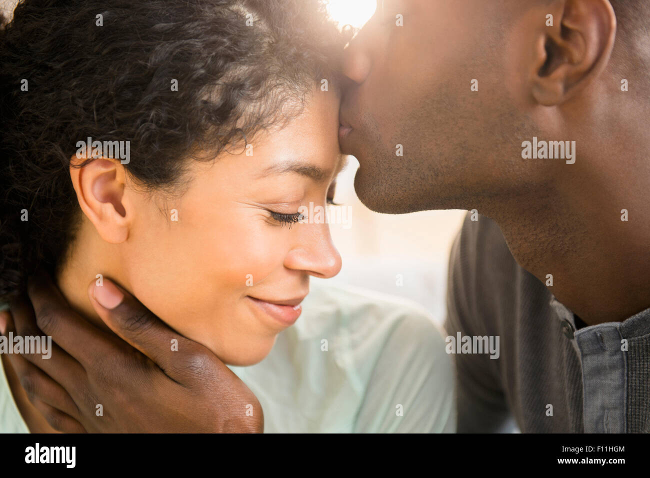 Close up of smiling couple kissing Stock Photo
