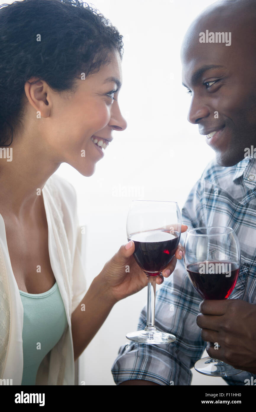 Couple drinking glasses of red wine Stock Photo