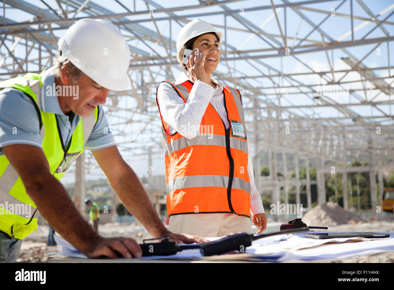 Architects working at construction site Stock Photo