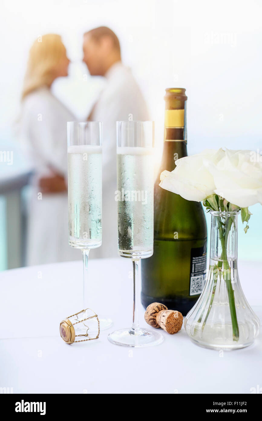 Close up of champagne glasses on balcony table Stock Photo