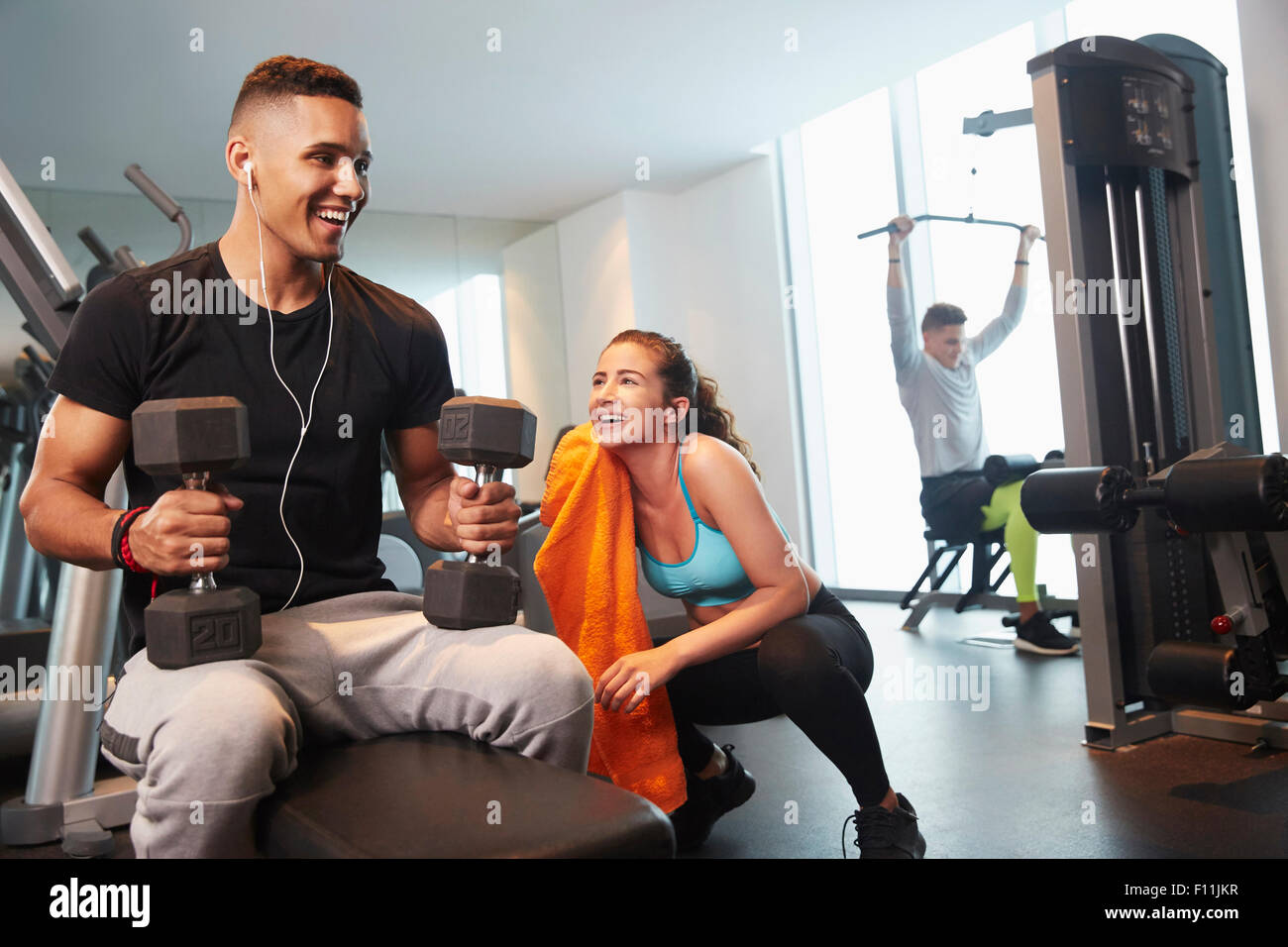 Friends working out in gym Stock Photo