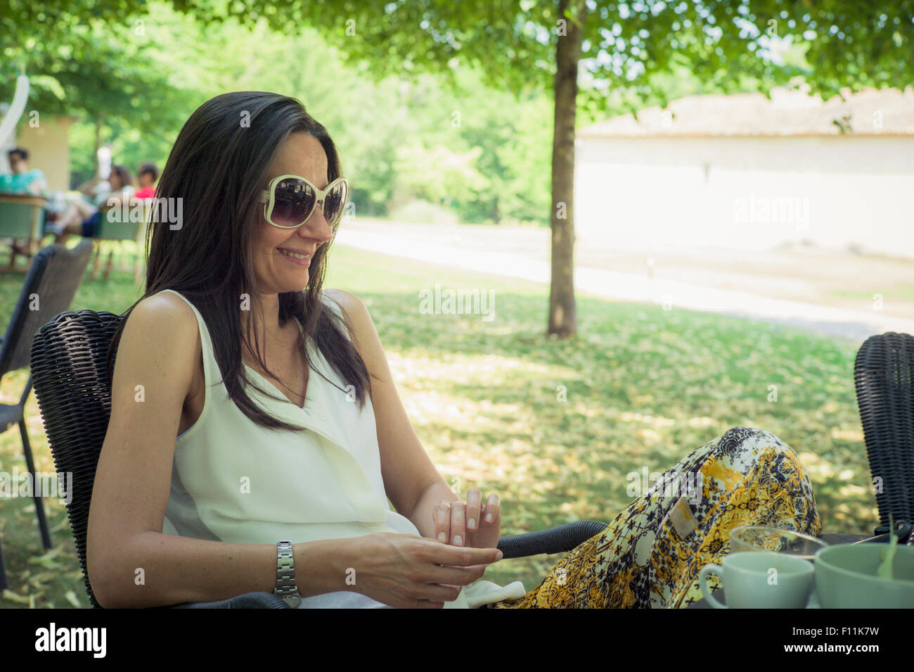 Woman sitting chair side view hi-res stock photography and images - Alamy