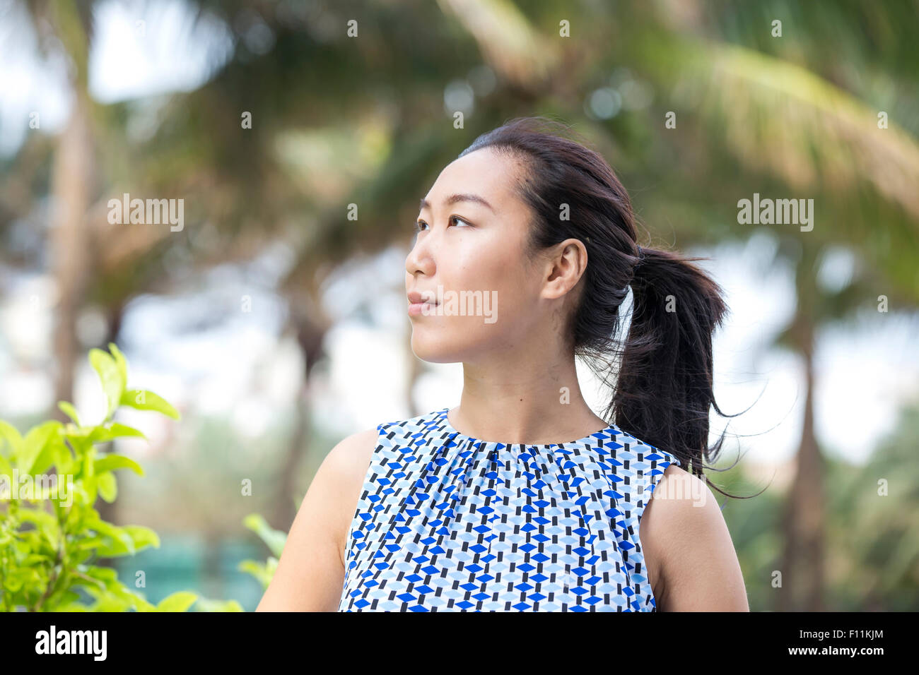 Asian businesswoman smiling outdoors Stock Photo