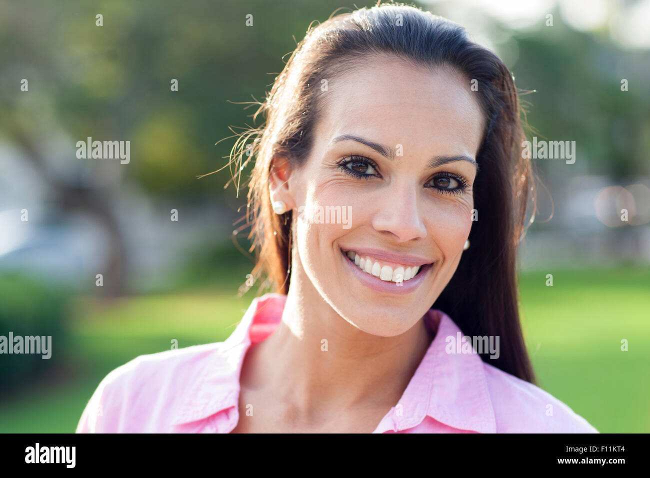 Close up of Hispanic woman smiling outdoors Stock Photo - Alamy