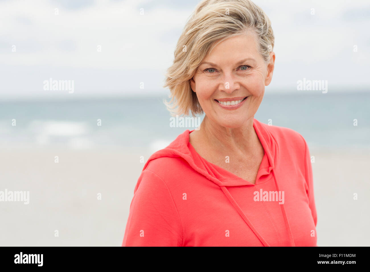 Older woman happy beach hi-res stock photography and images - Alamy