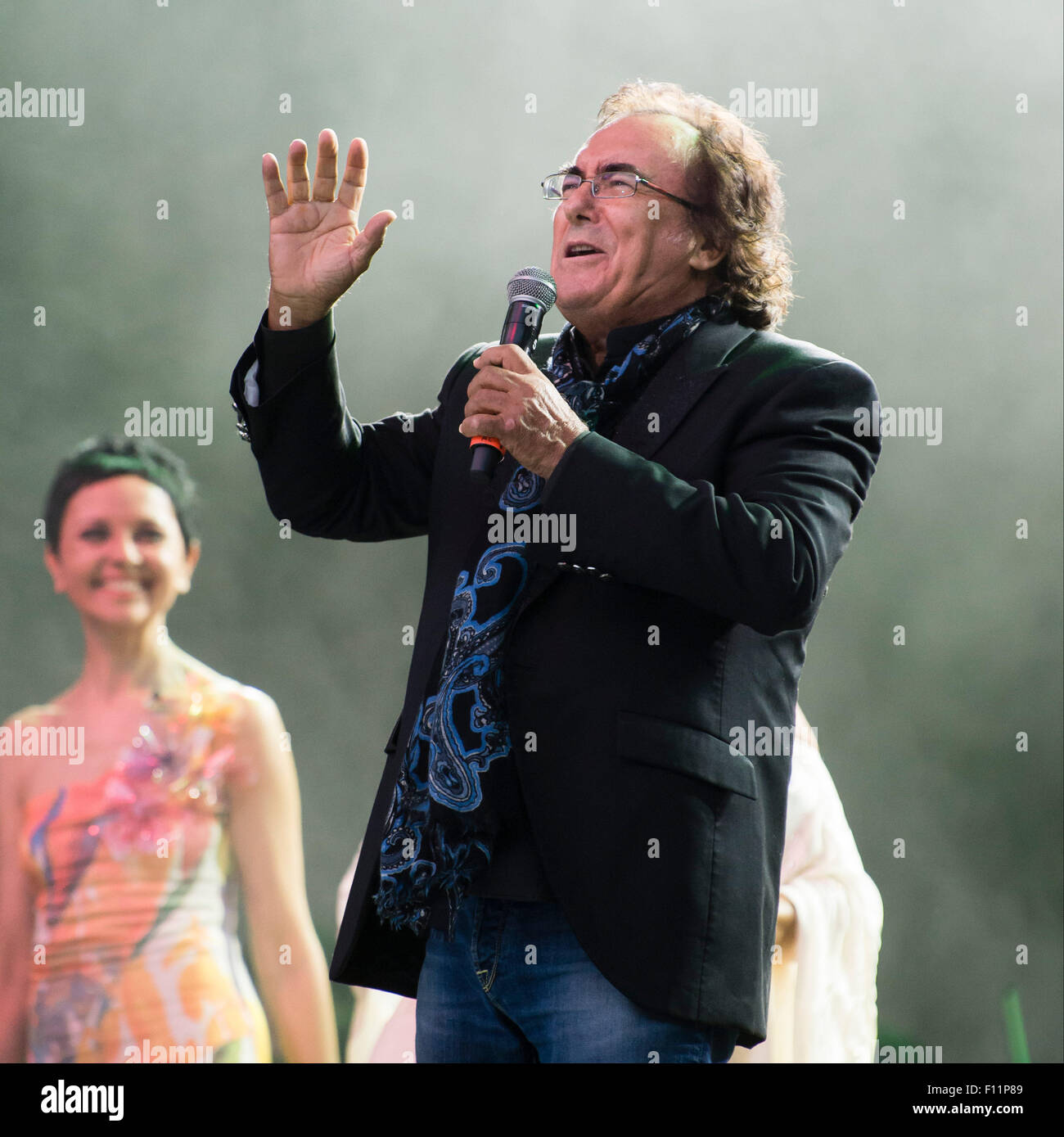 Berlin, Germany. 21st Aug, 2015. Albano Carrisi (Al Bano) performs on stage during a concert with Romina Power (unseen) in Berlin, Germany, 21 August 2015. The concert of the singing duo Al Bano and Romina Power was their first in the German-speaking region in 20 years. Photo: Gregor Fischer/dpa/Alamy Live News Stock Photo