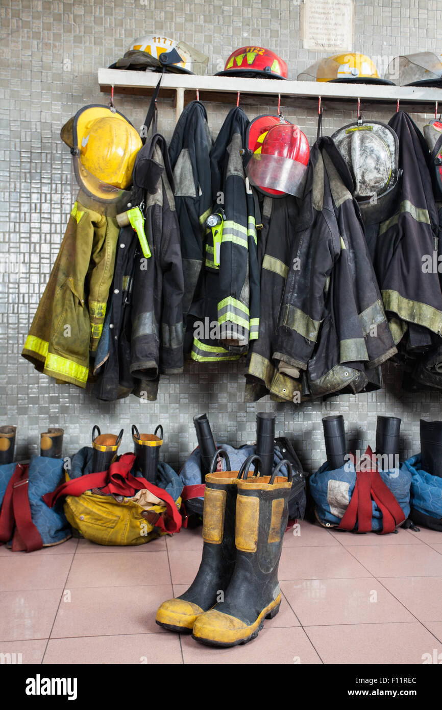 Firefighter Uniforms At Fire Station Stock Photo