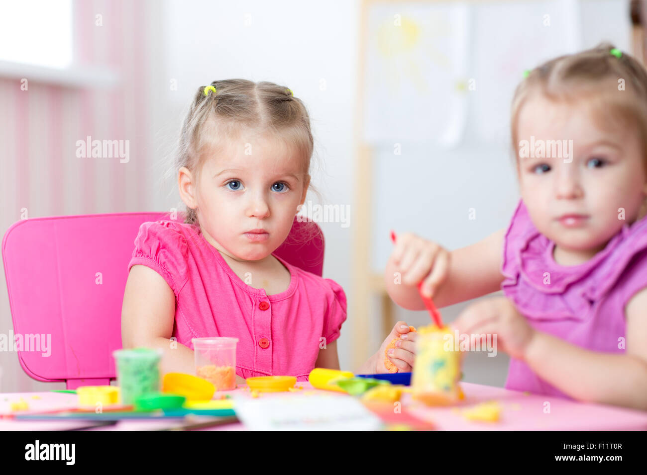 Kids Playing With Colorful Clay Molding Different Shapes