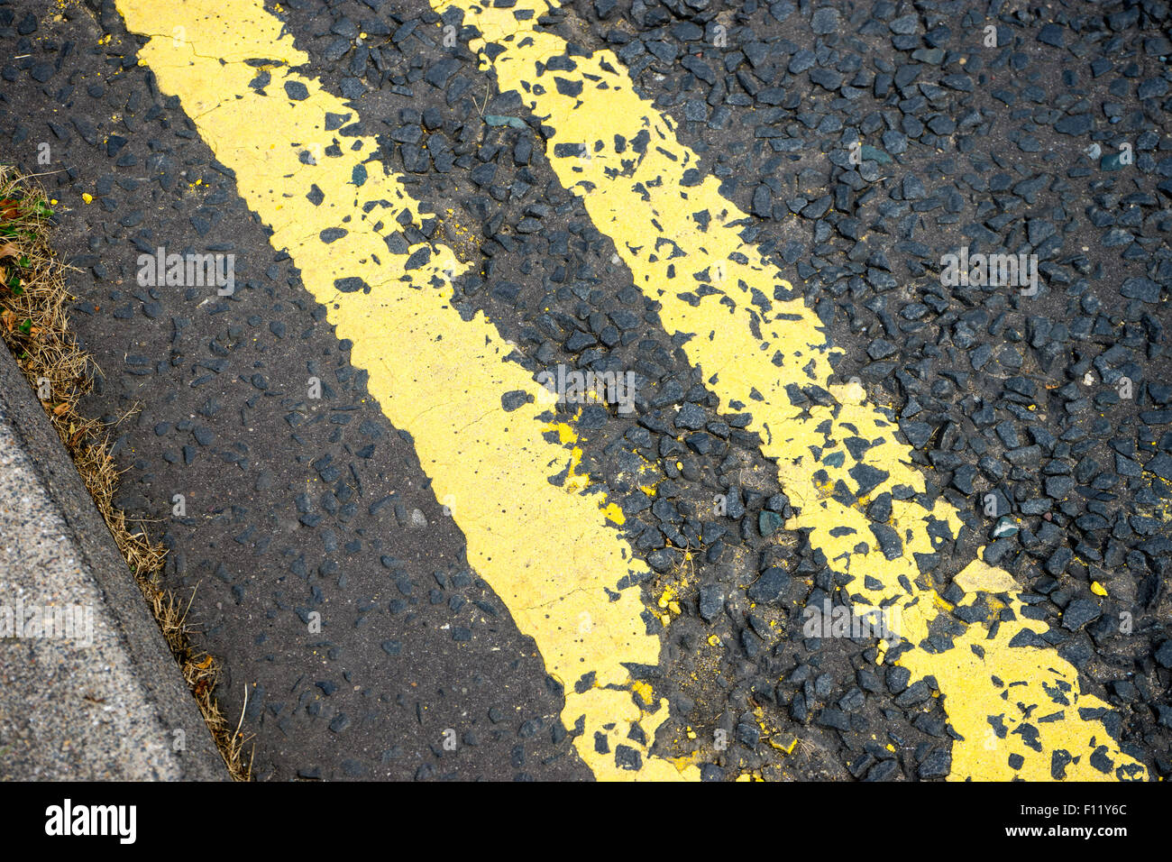 Double yellow lines on a tarmac road Stock Photo Alamy