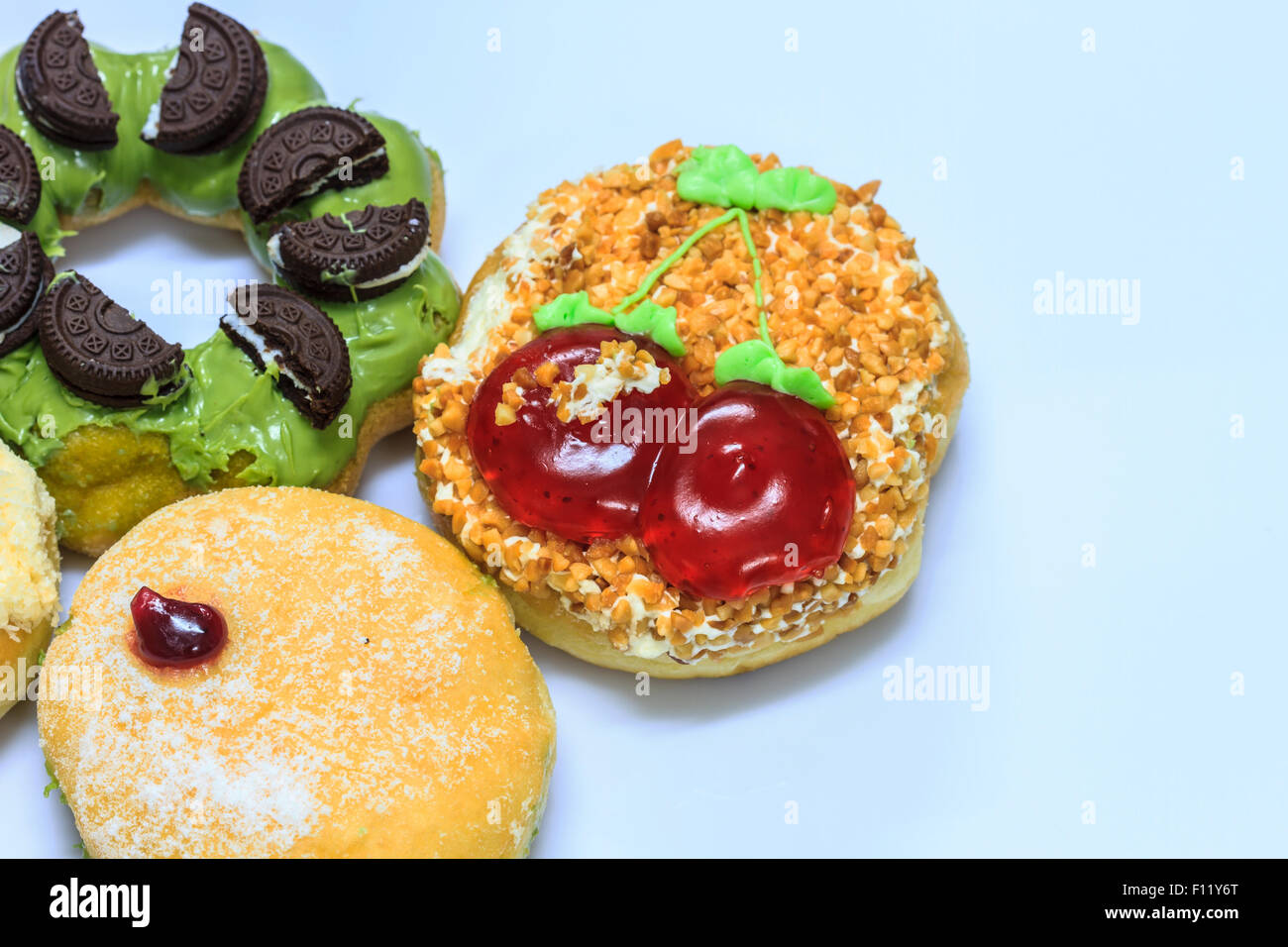 close up delicious Colorful donut on white background Stock Photo - Alamy