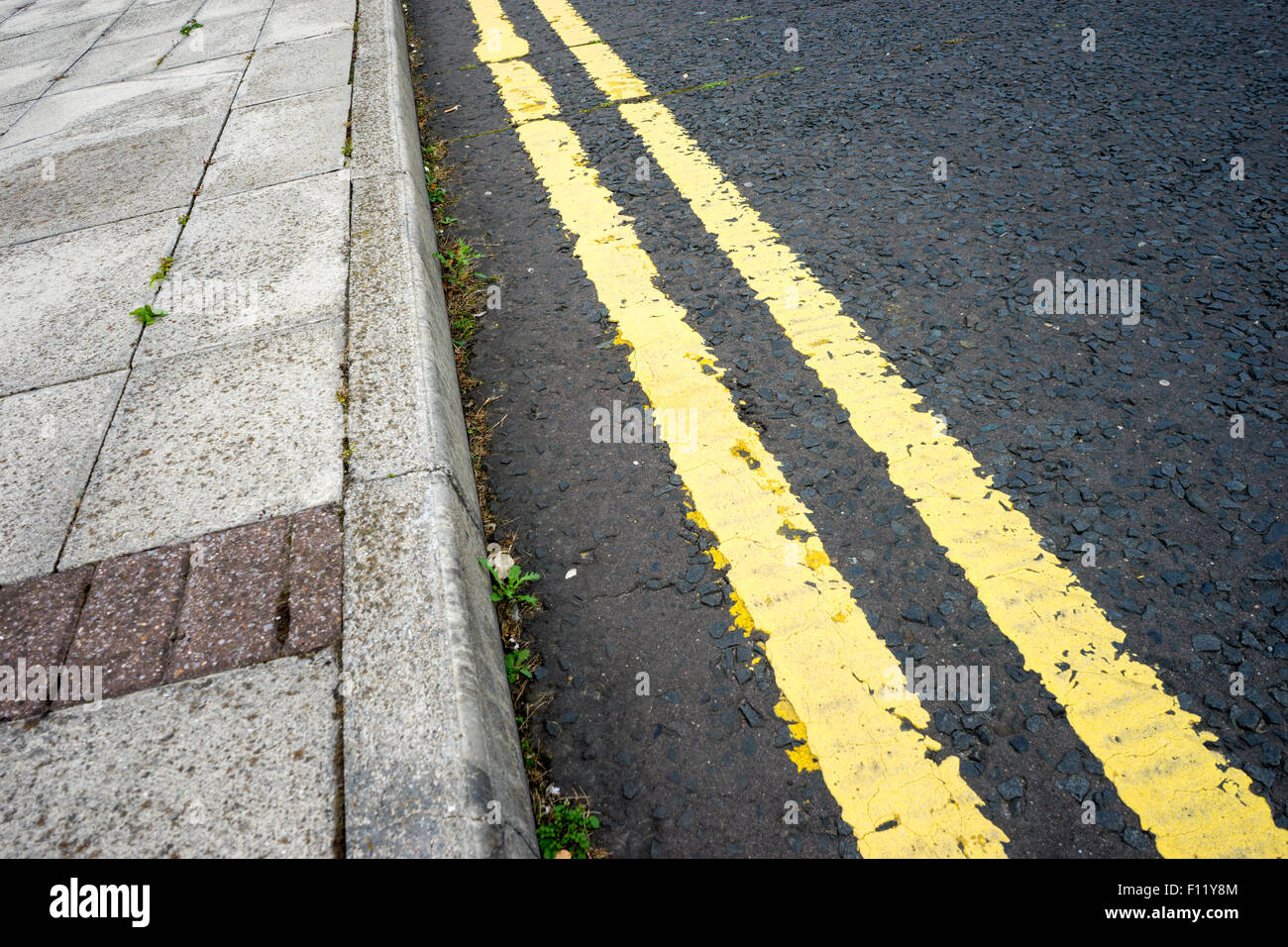 Double yellow lines on a tarmac road Stock Photo Alamy