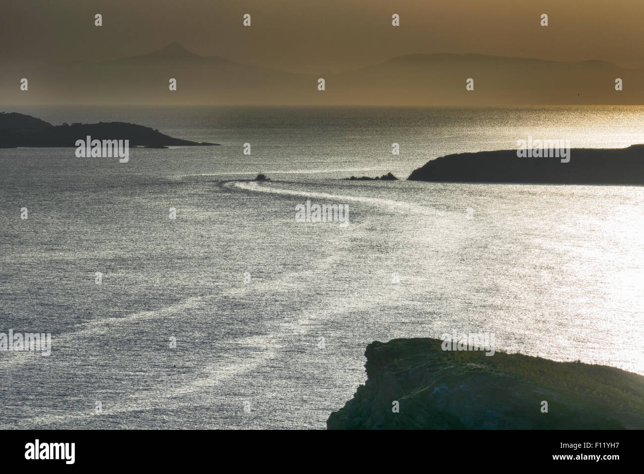 Fast boat travelling against the beautiful horizon. Stock Photo