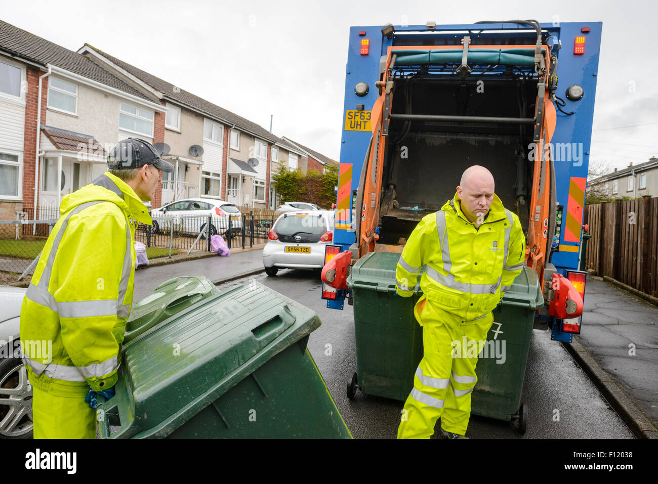 Bin men on thier refuse collection round in a small town in Scotland