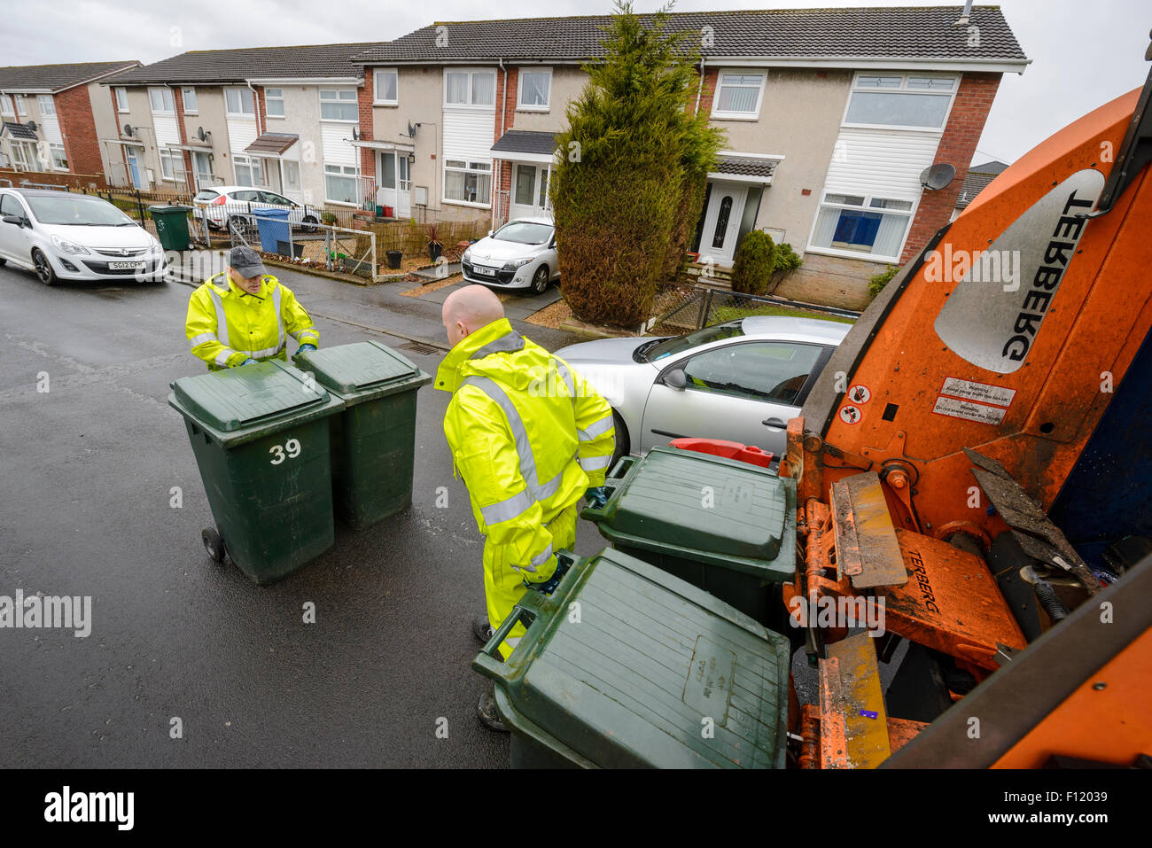 Bin men on thier refuse collection round in a small town in Scotland