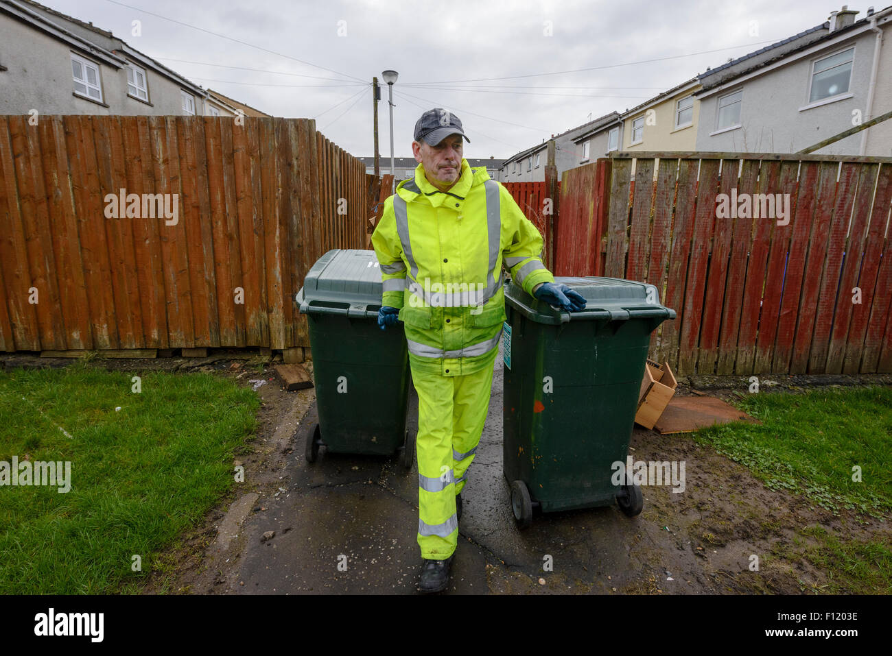 Bin men on thier refuse collection round in a small town in Scotland Stock Photo