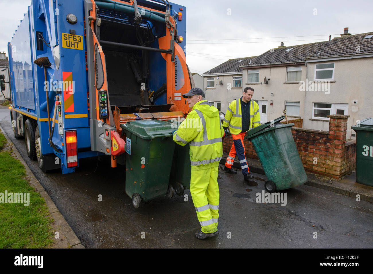 Bin men on thier refuse collection round in a small town in Scotland