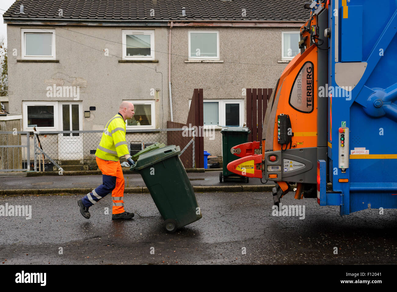 Bin men on thier refuse collection round in a small town in Scotland