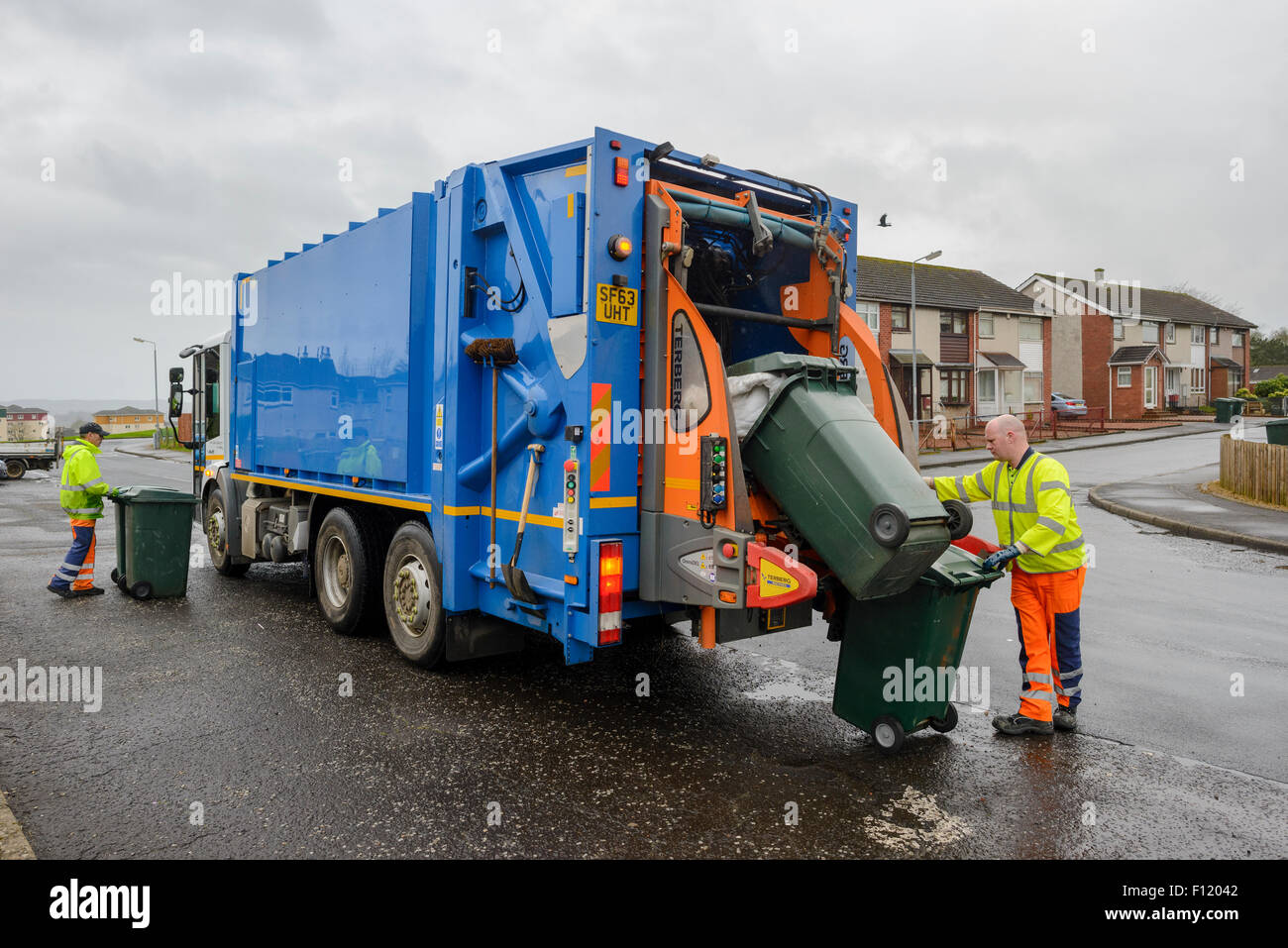 Bin men on thier refuse collection round in a small town in Scotland