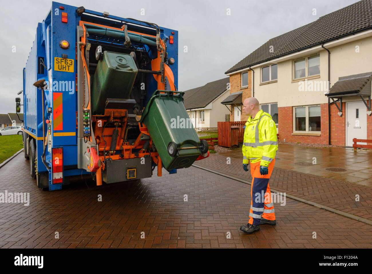 Bin men on thier refuse collection round in a small town in Scotland