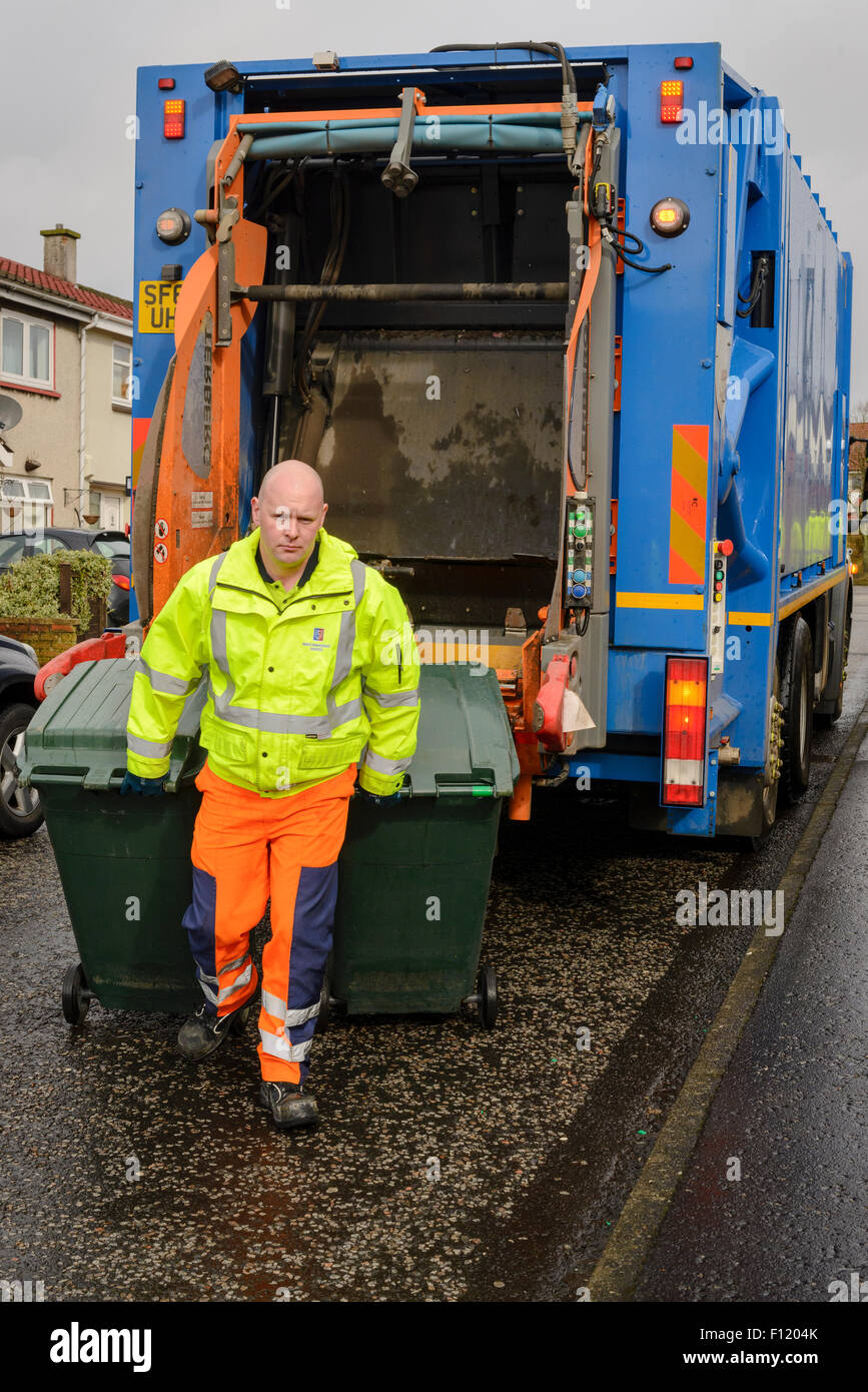 Bin men on thier refuse collection round in a small town in Scotland Stock Photo Alamy