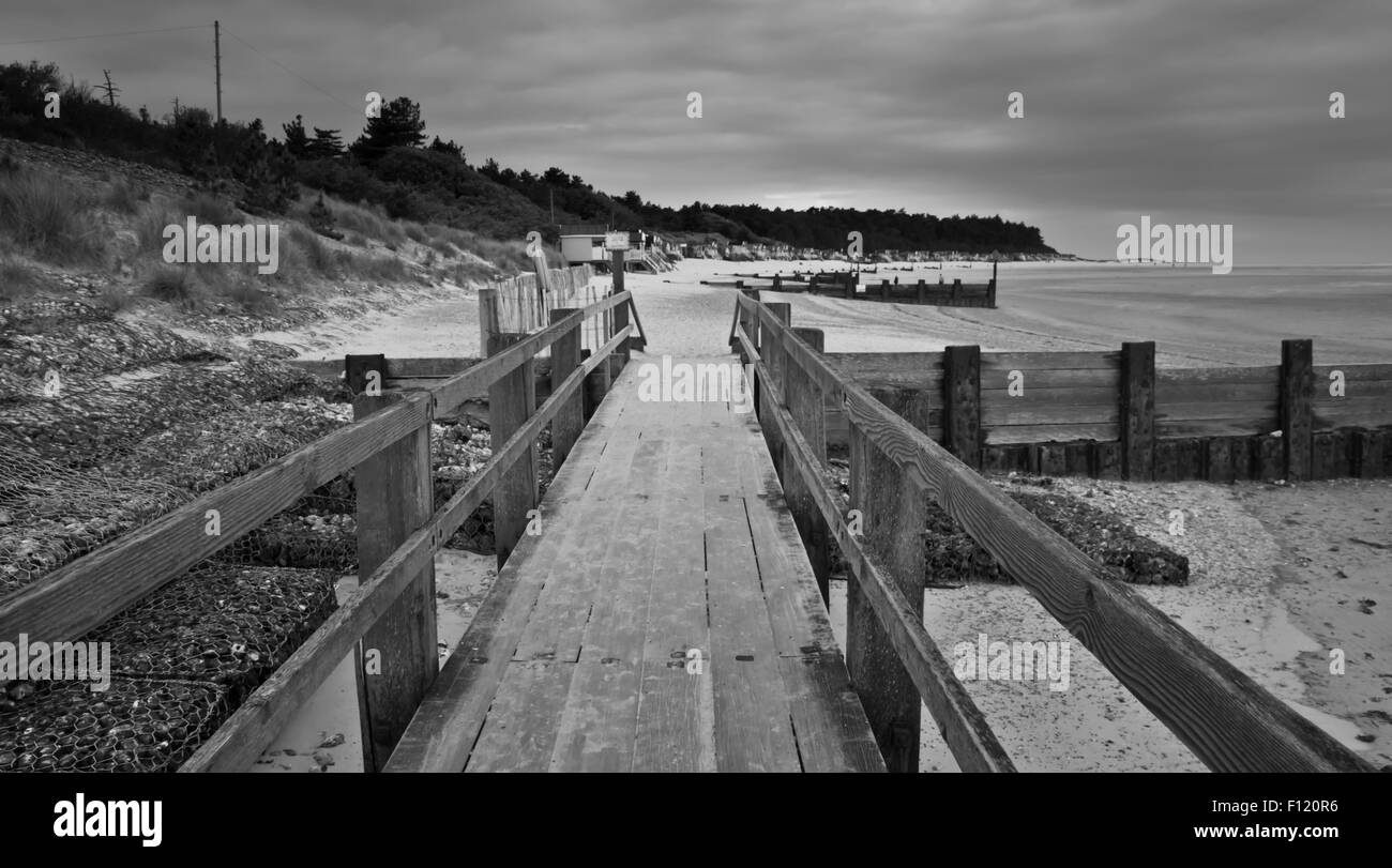 black and white image of a beach wooden walkway Stock Photo - Alamy