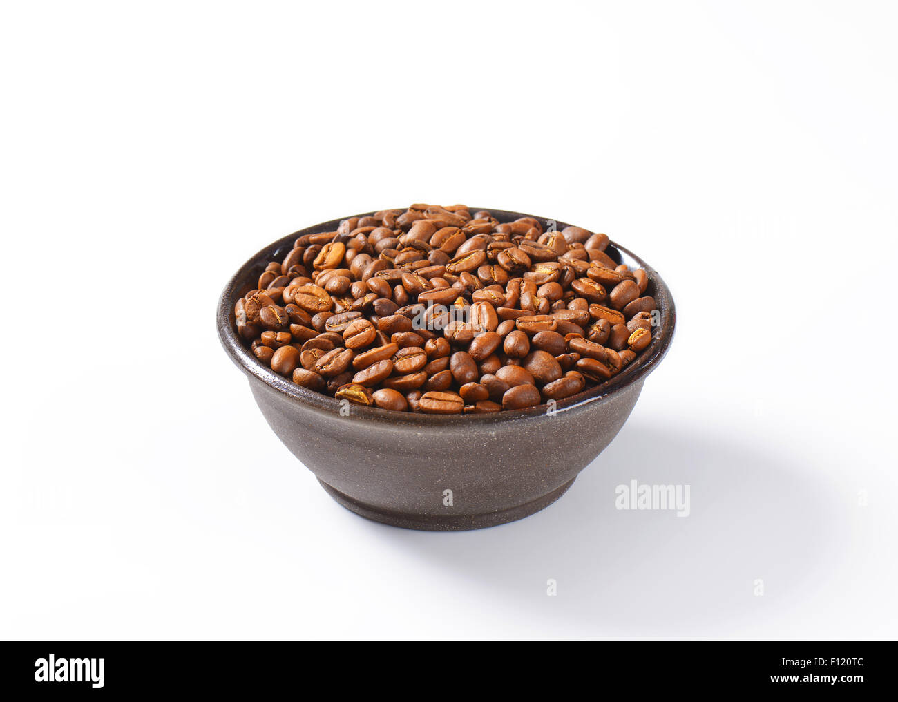 Bowl of medium roasted coffee beans Stock Photo - Alamy