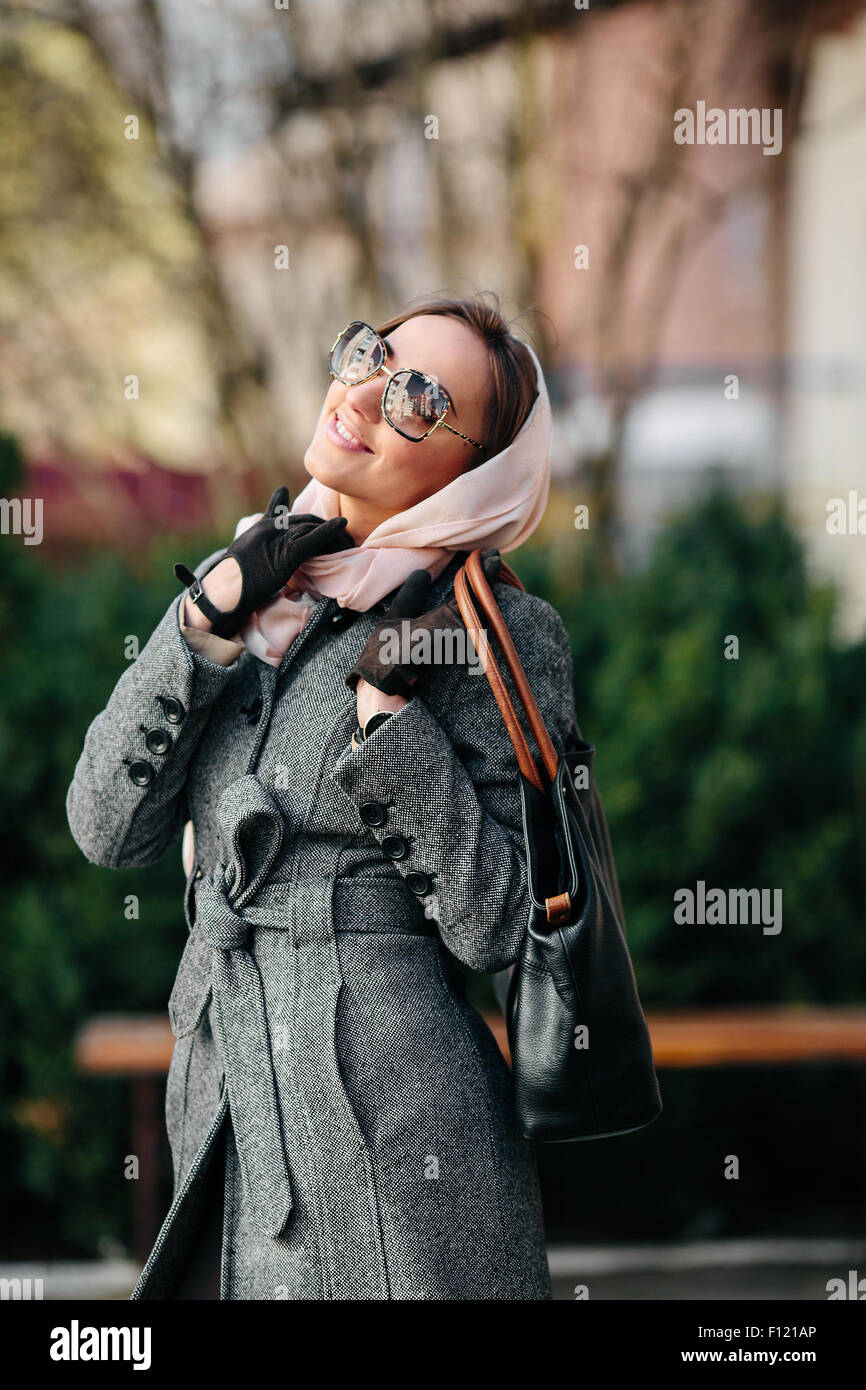 Happy young beautiful girl posing in the park Stock Photo - Alamy