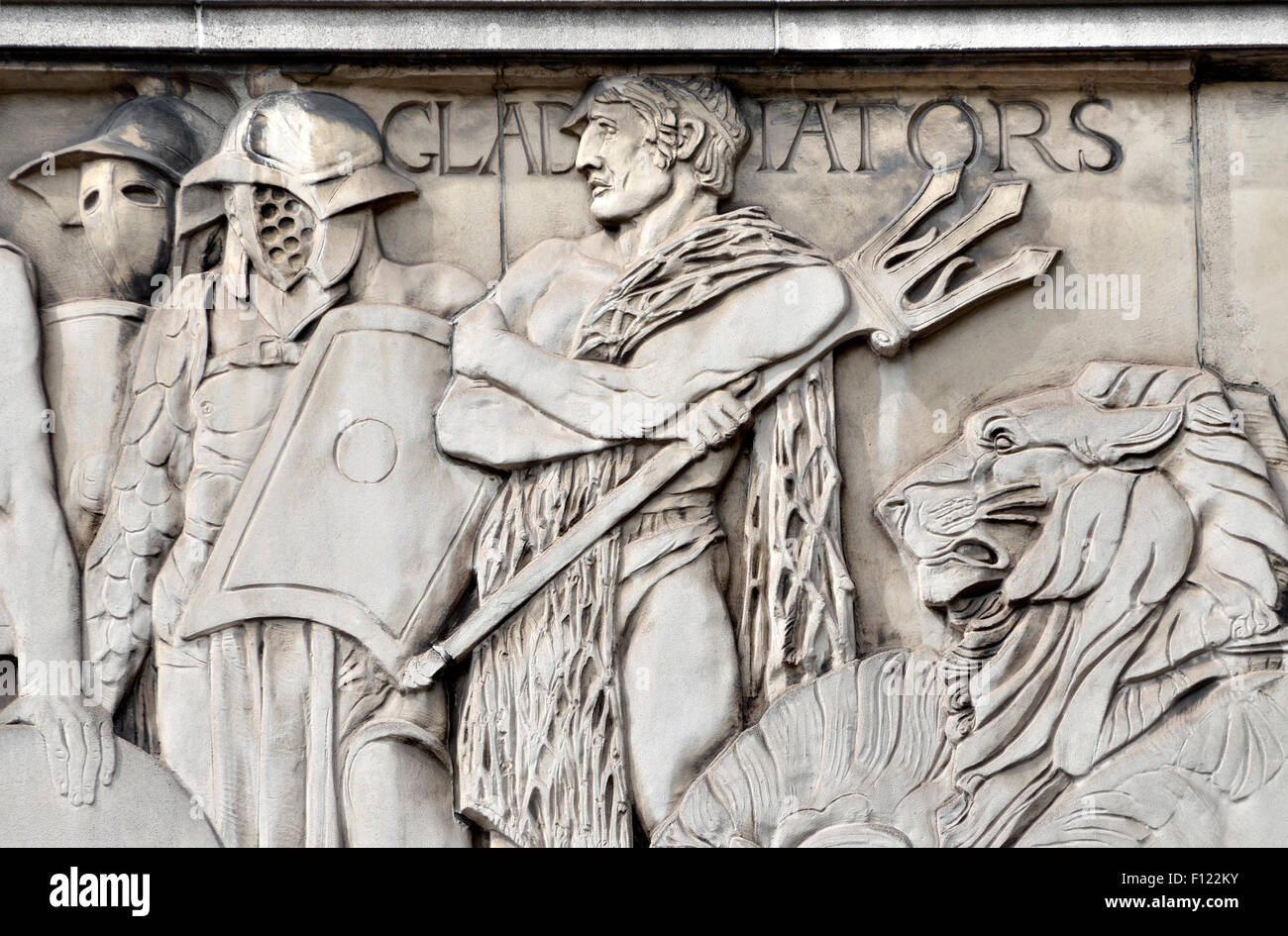 London, England, UK. Frieze on outside wall of the Saville Theatre (by Gilbert Bayes, 1931) Gladiators Stock Photo