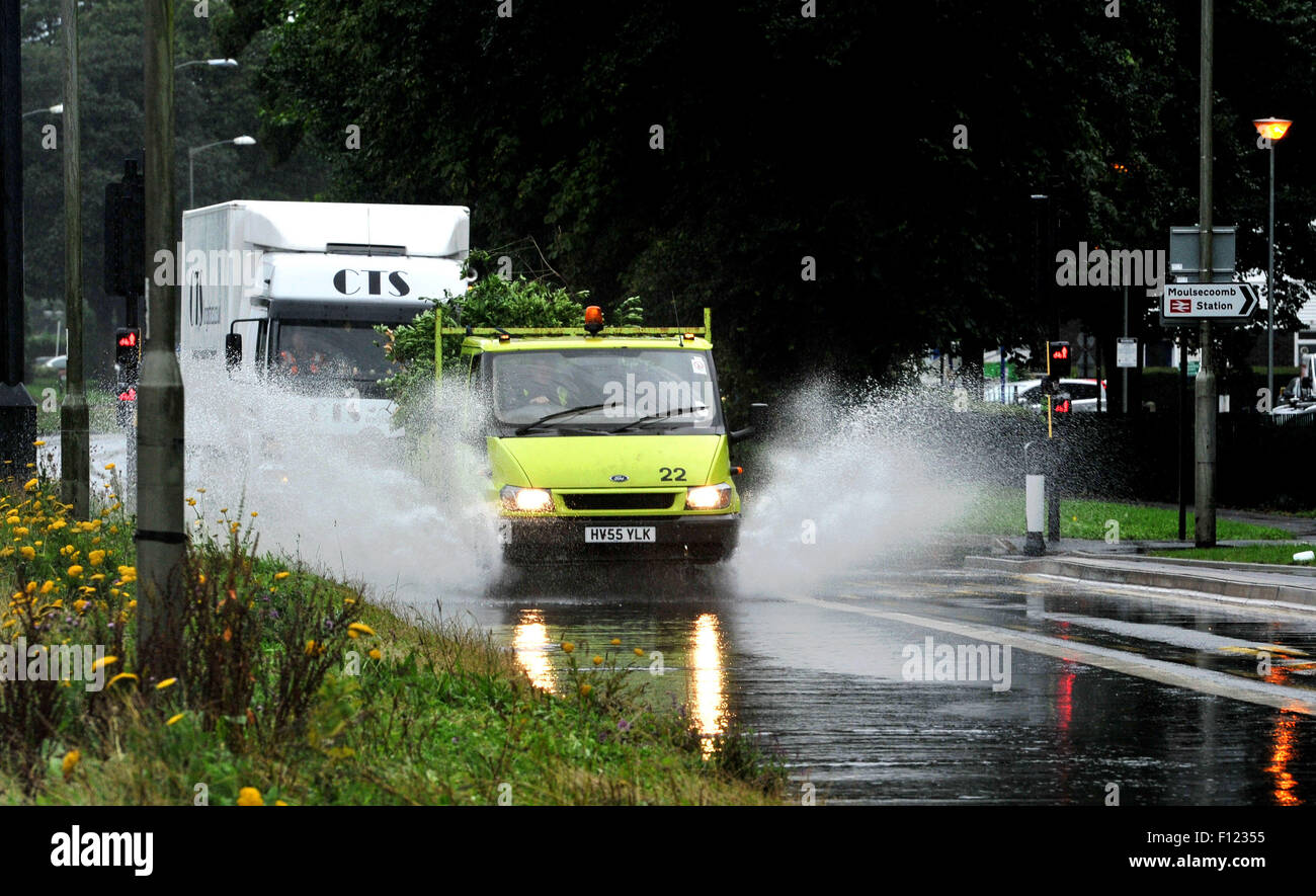 Brighton, UK. 25th August, 2015. Traffic drives through flooded roads as torrential rain today hit the centre of Brighton and Hove . Stock Photo