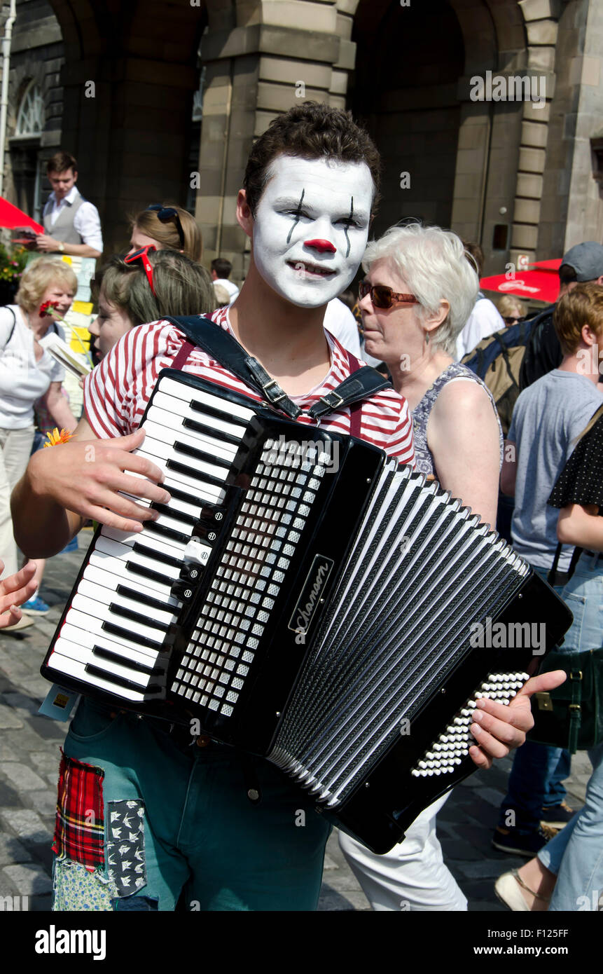Accordionist in strange make-up promoting his show at the Edinburgh Festival Fringe in 2015. Stock Photo