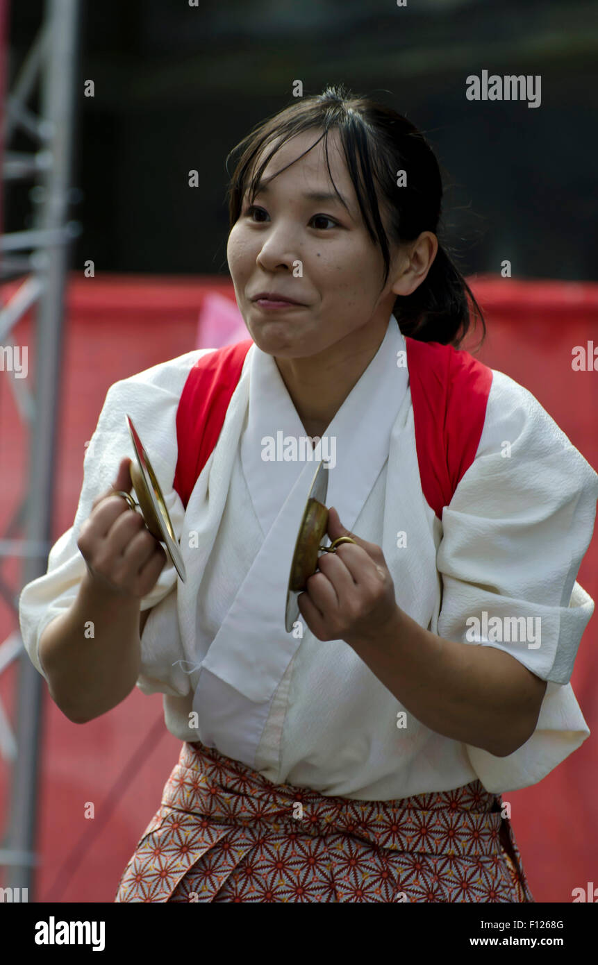 Member of a Japanese drum band performing a part of their show at the