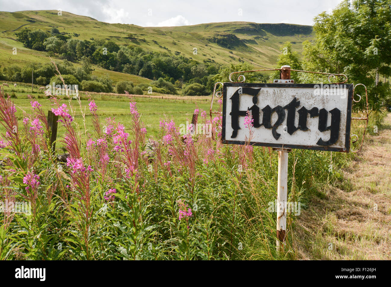 Ornamental village sign for the small rural village of Fintry which lies below the Fintry Hills, part of the Campsie Fells Stock Photo