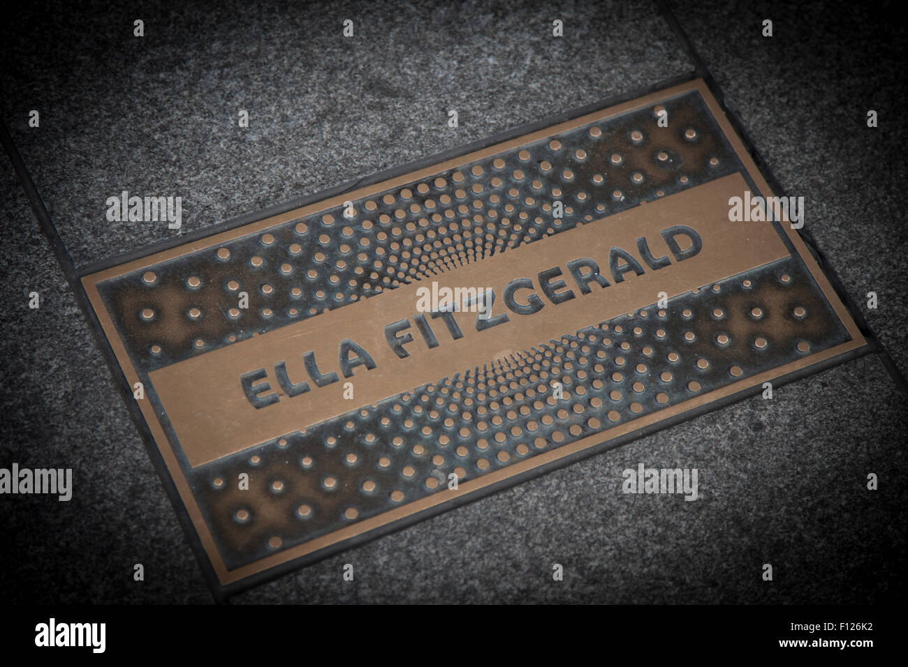 Ella Fitzgerald paving slab in front of famous Apollo theatre in Harlem New York City Stock Photo