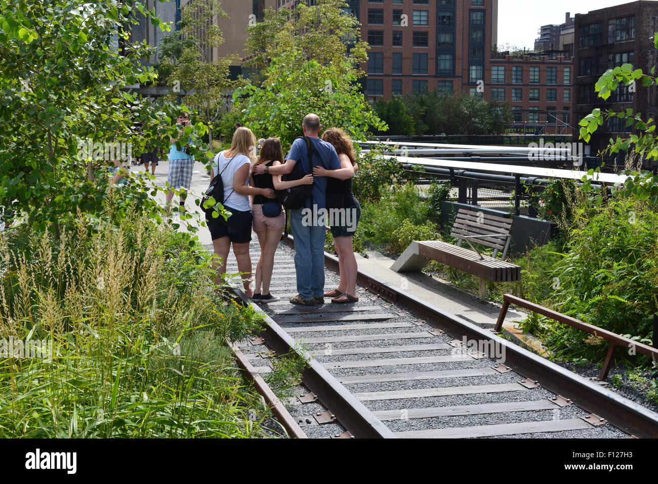 People taking pictures on the High Line in Manhattan. Stock Photo